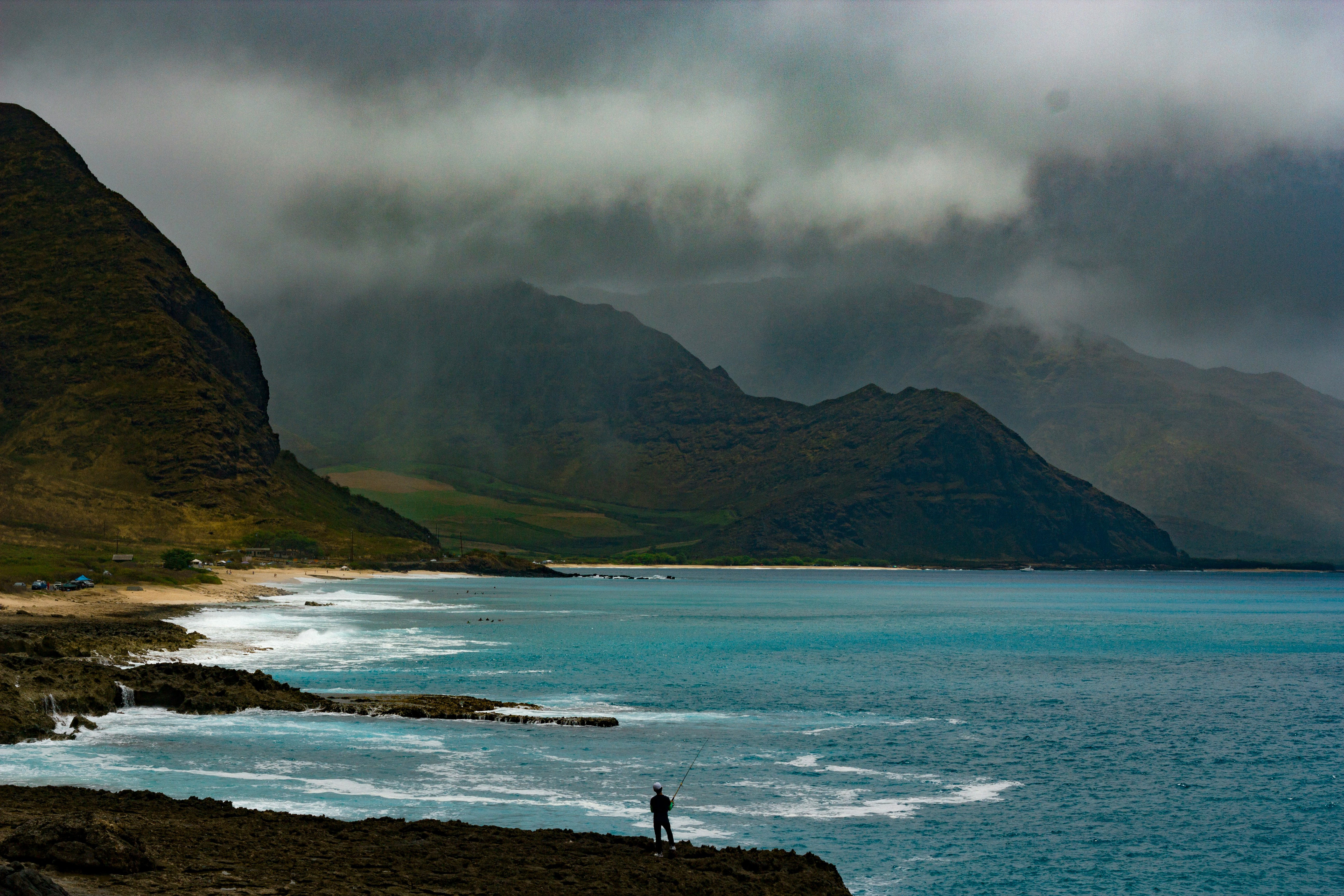 landscape photography of mountains near body of water